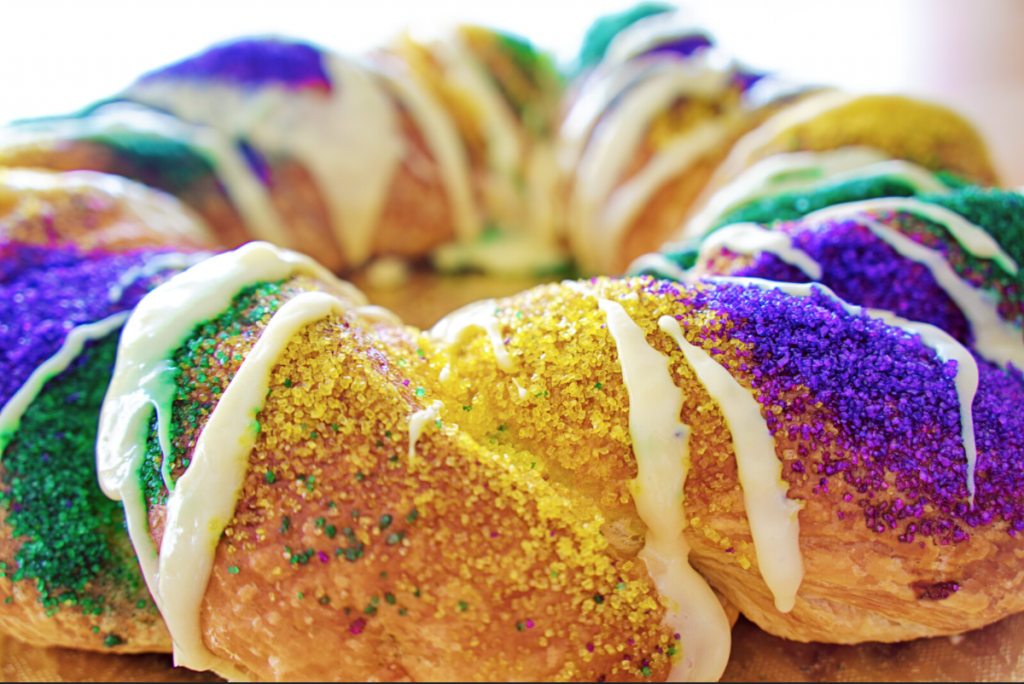 King Cake, a delicious treat that's an important part of Mardi Gras history, is enjoyed during Carnival season in New Orleans